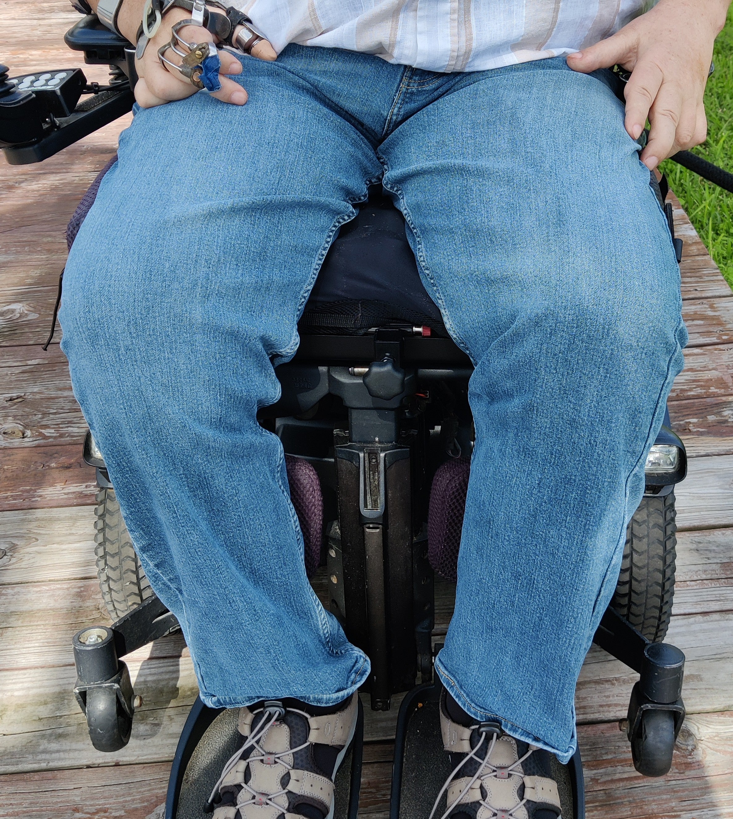 Example of Hands-On adaptive fishing rod holder base under wheelchair seat cushion with rod holder removed