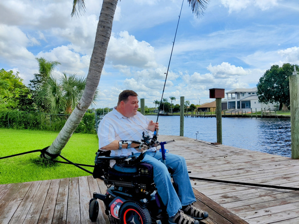 Hands-on Adjustable, Hinged Fish Fighting Rod Holder for Wheelchair Seat -  Mark in wheelchair on dock - wide view