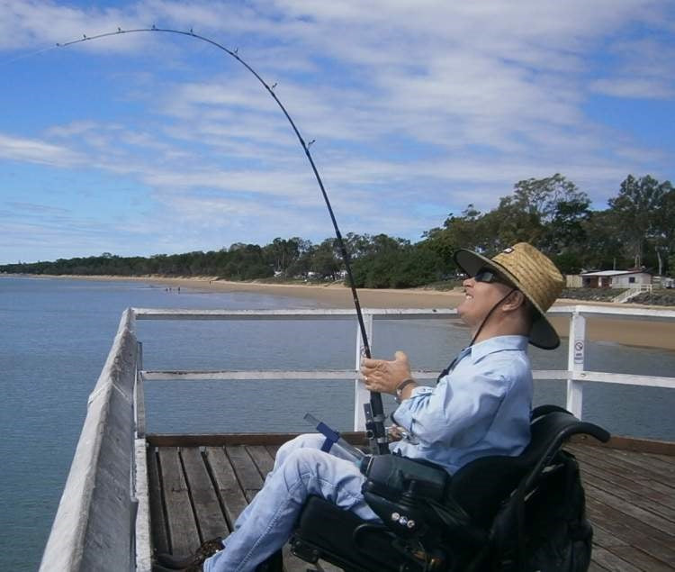 Hands-on Adjustable, Hinged Fish Fighting Rod Holder for Wheelchair Seat -  fighting a fish