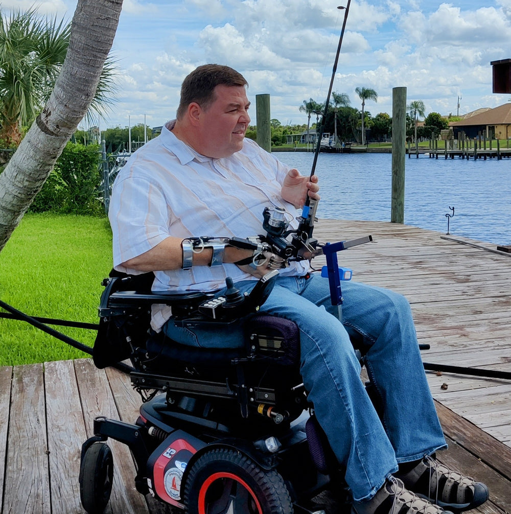 Hands-on Adjustable, Hinged Fish Fighting Rod Holder for Wheelchair Seat -  Mark in wheelchair on dock closeup